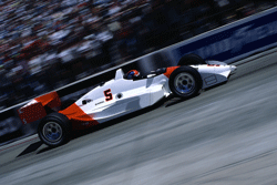 Red and White Formula Car Racing on track